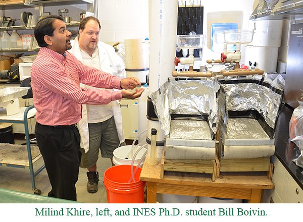 Professor Milind Khire and a PhD student working in a lab