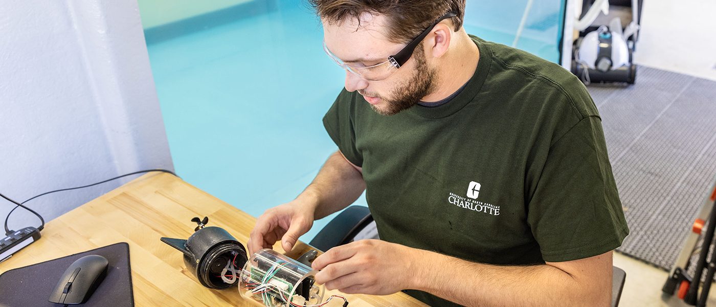 Student works on electrical project in the BATT CAVE Research Center