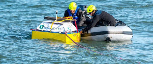 Teams competing in the Waves To Water American Made Water Prize contest deploy their desalination devices from Jennette’s Pier in the Outer Banks of North Carolina