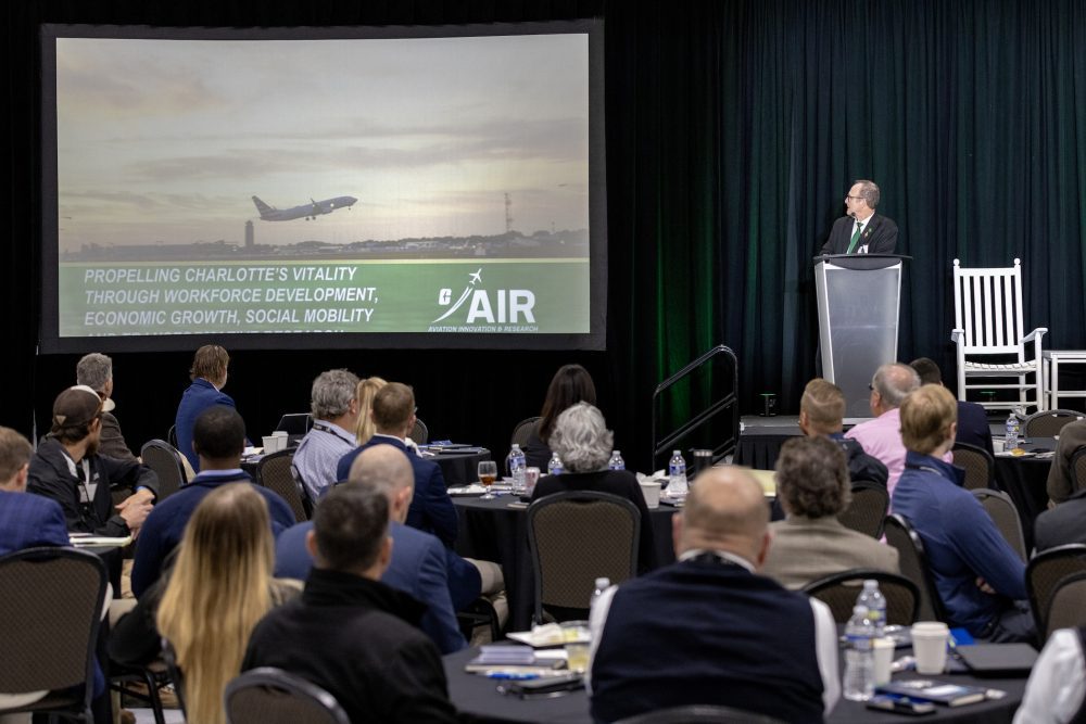 Image shows Dean Rob Keynton giving a presentation