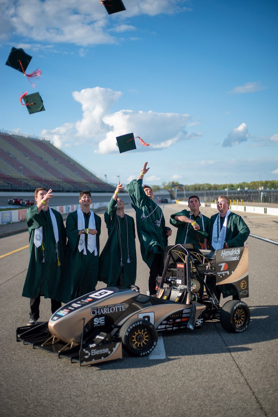 Senior members of 49ers Racing team wearing their caps and gowns