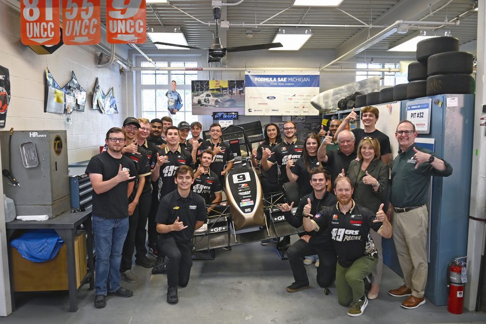 49er Racing team pictured with race car