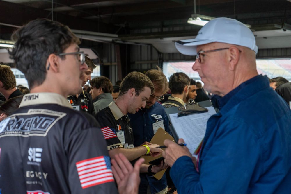 49ers Racing team member speaks to judge during competition