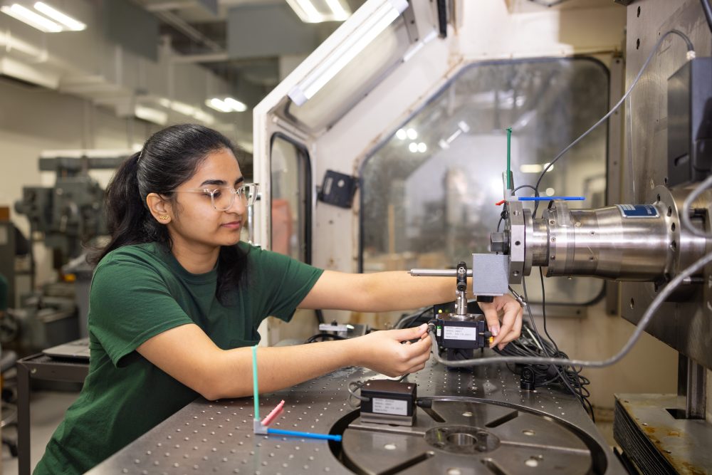 Student works on machine