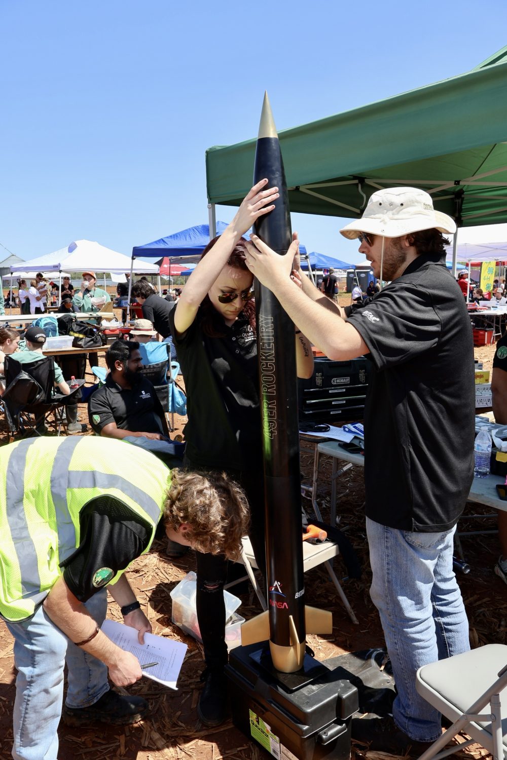 49er Rocketry team member prepares rocket for launch